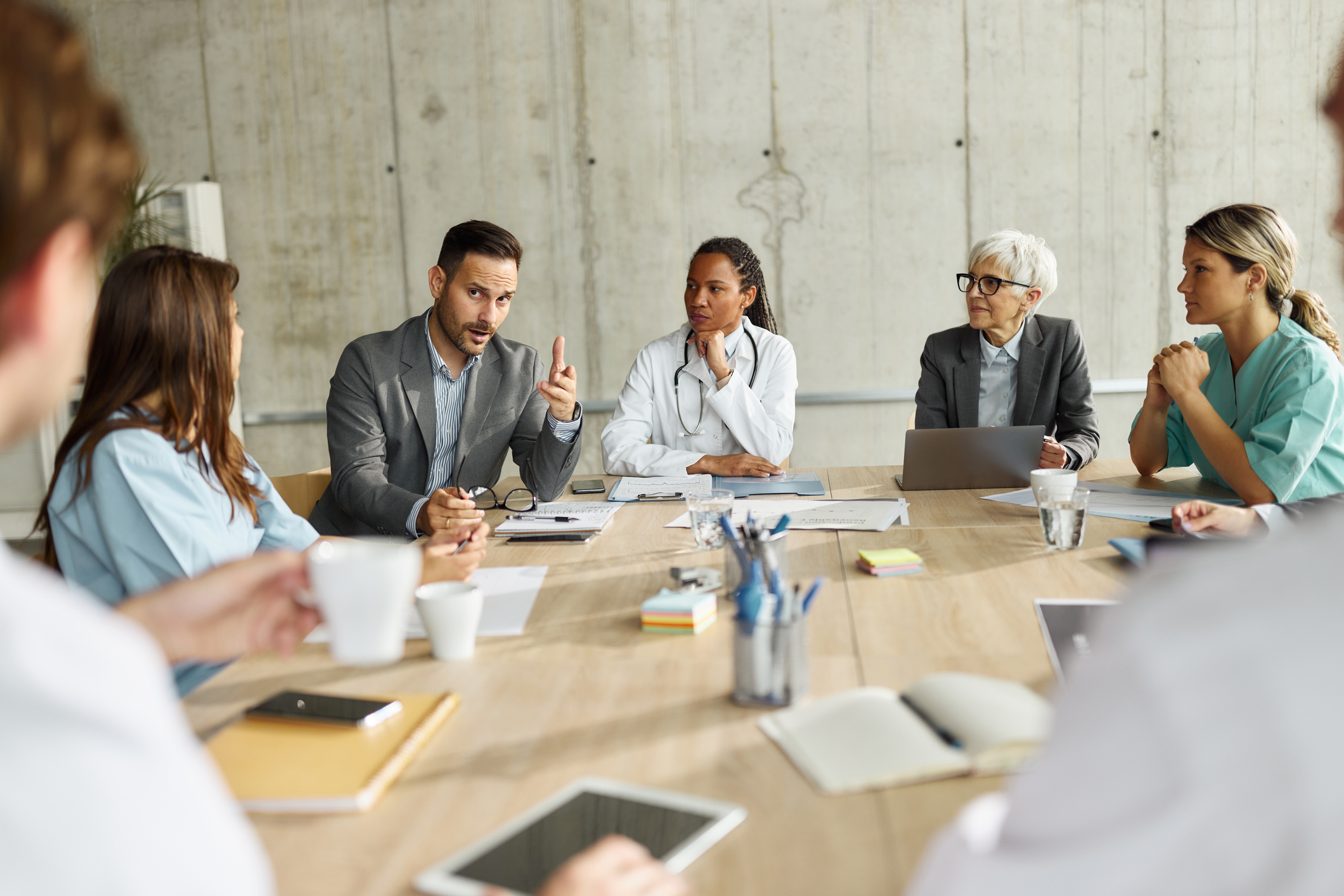 An interdisciplinary healthcare team in a focused working discussion